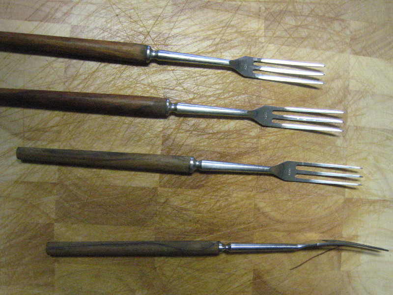 4 different views of traditional fondue forks
