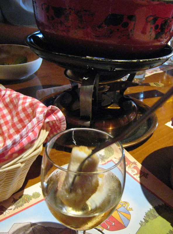 piece of bread dipped in a wine glass